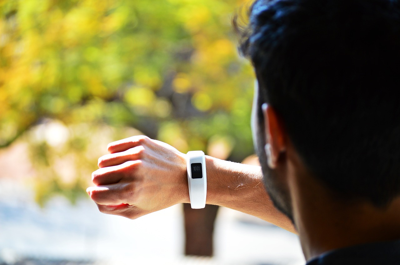 Person looking at fitbit on wrist